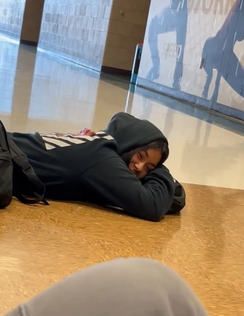 girl napping in the hallway